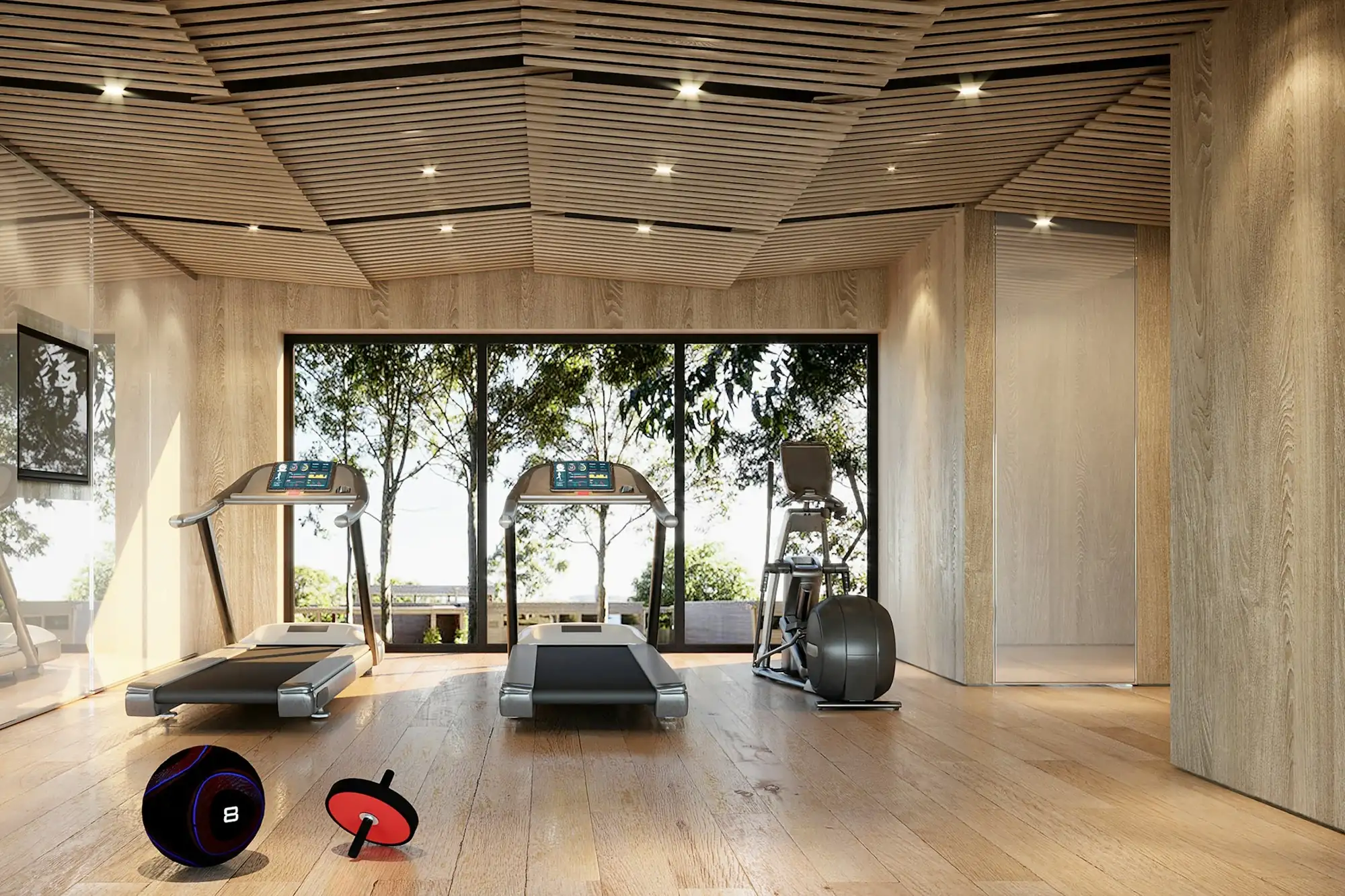 A gym with treadmills in front of a large window and a switched-off TV on the wall